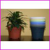 Doniczka Plastikowa Cyprys 4 Pastel ��ty o �rednicy 23cm. Cena za 25szt